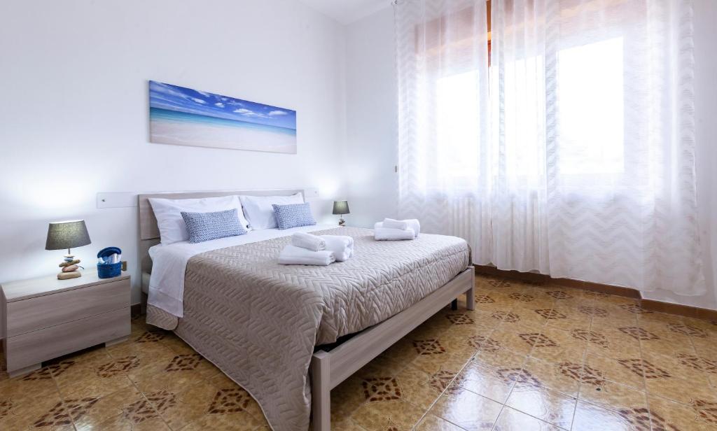 Postel nebo postele na pokoji v ubytování Lupomonaco Rooms
