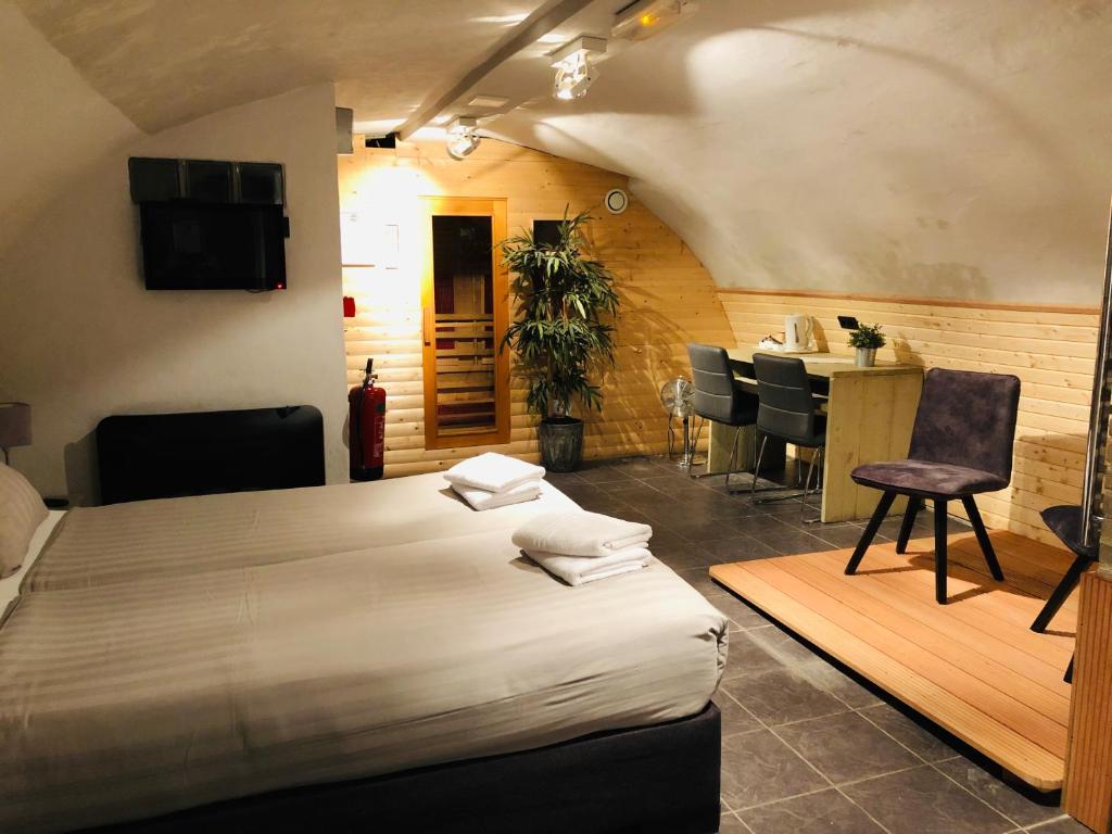 Postel nebo postele na pokoji v ubytování Hotel de Prince