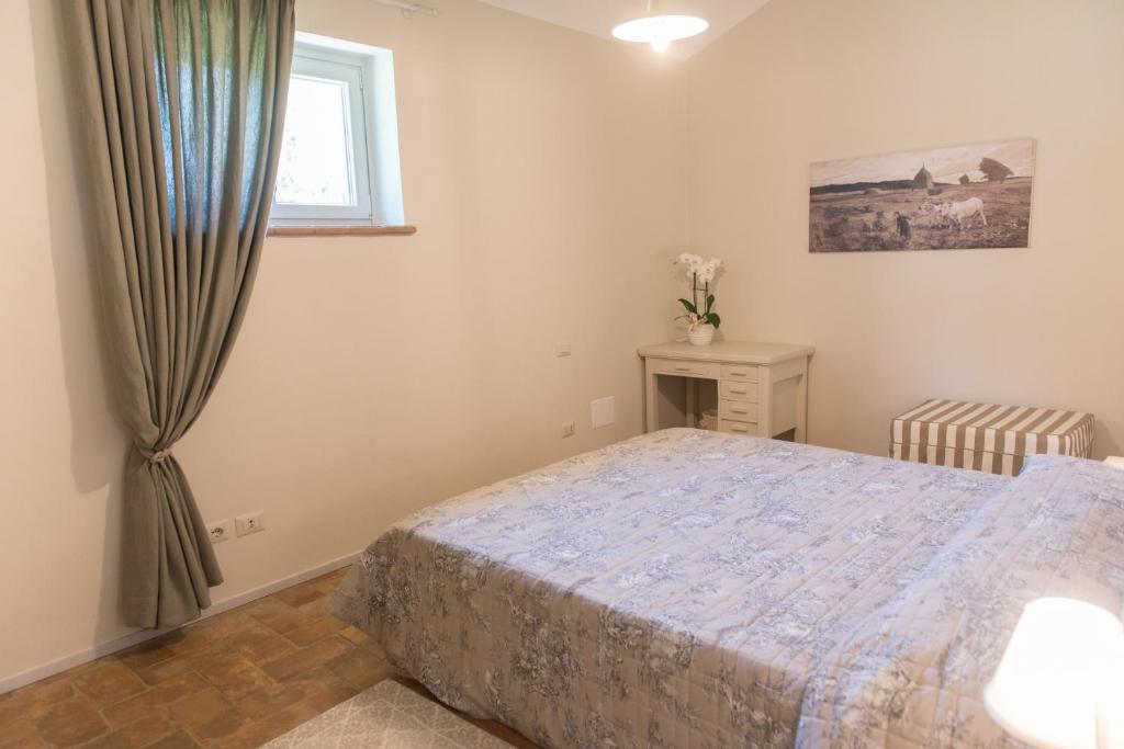 Postel nebo postele na pokoji v ubytování Agriturismo Poderedodici