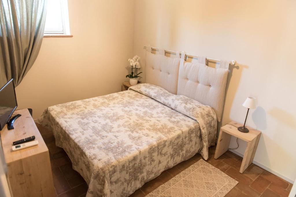 Postel nebo postele na pokoji v ubytování Agriturismo Poderedodici
