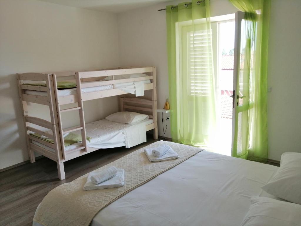 Posteľ alebo postele v izbe v ubytovaní Apartment Roky