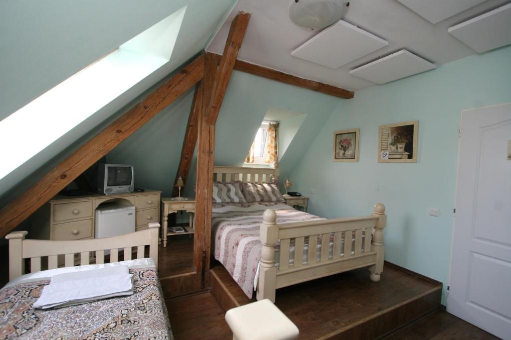 Postel nebo postele na pokoji v ubytování Pension Grant Lux Znojmo
