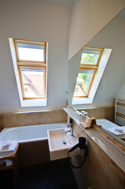 Koupelna v ubytování Qube Hotel Bergheim