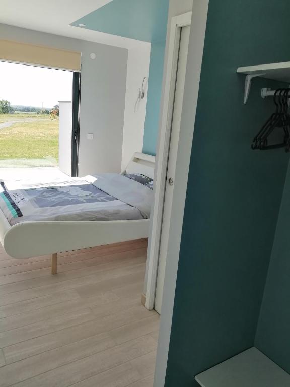 Postel nebo postele na pokoji v ubytování Le Temps d'un Rêve