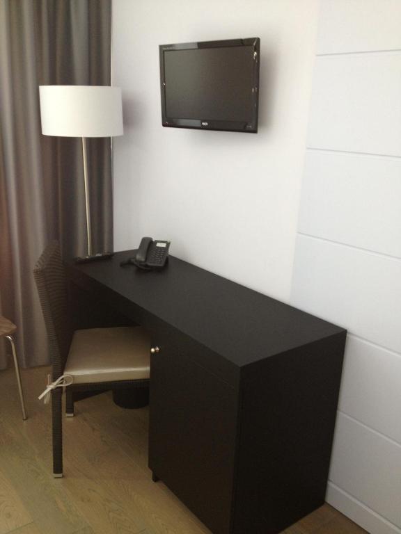 TV a/nebo společenská místnost v ubytování Tag Hotel