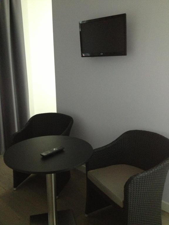 TV a/nebo společenská místnost v ubytování Tag Hotel