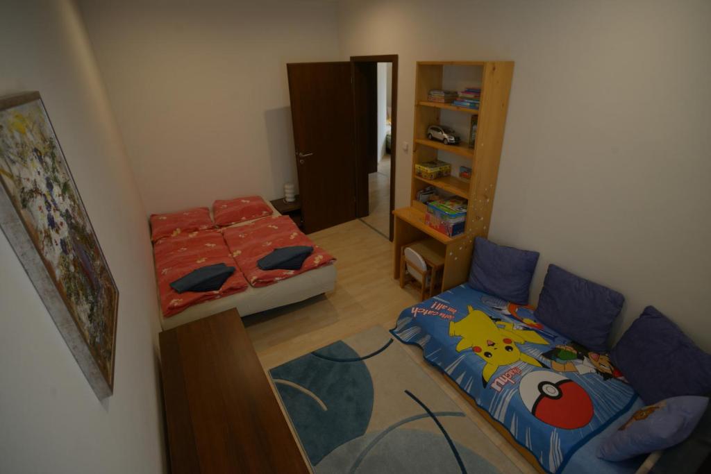 A bed or beds in a room at Apartmán Lomnica