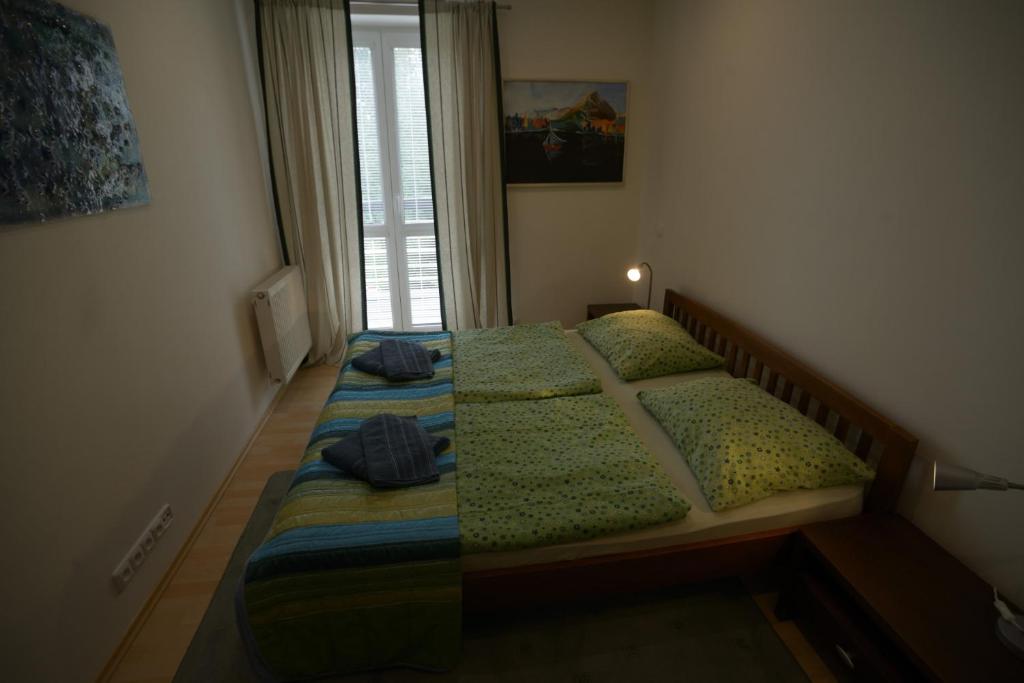 A bed or beds in a room at Apartmán Lomnica