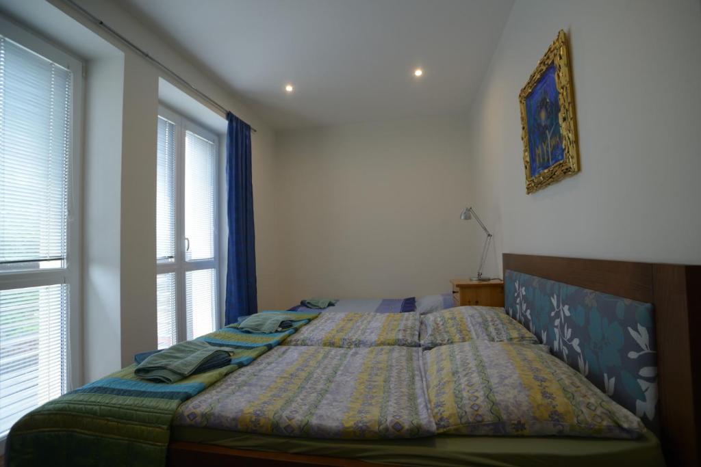 A bed or beds in a room at Apartmán Lomnica