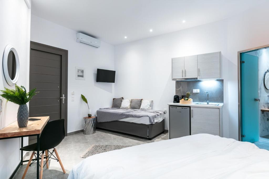 Postel nebo postele na pokoji v ubytování Delight Suites