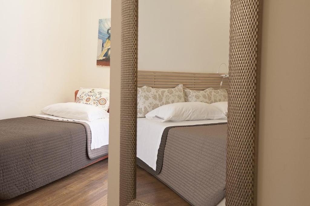 Postel nebo postele na pokoji v ubytování Camere a Sud