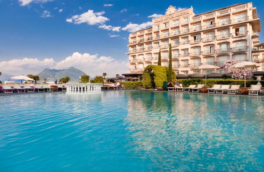 a swimming pool in front of a hotel at Grand Hotel Bristol in Stresa