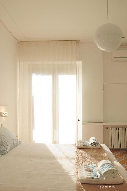 Postel nebo postele na pokoji v ubytování Agorà b&b