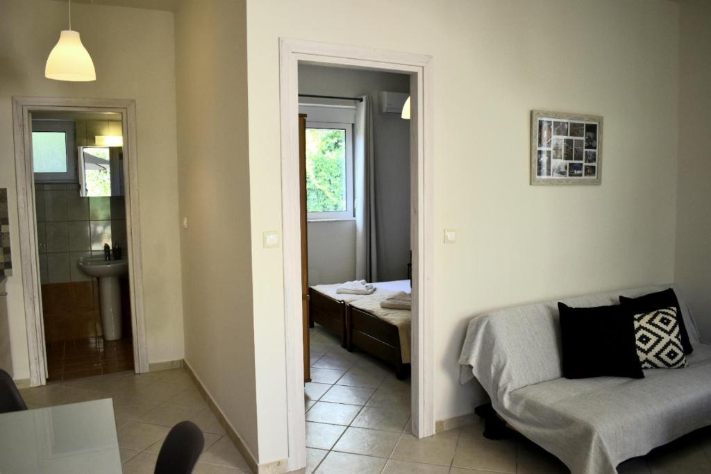 Postel nebo postele na pokoji v ubytování Pasithea apts
