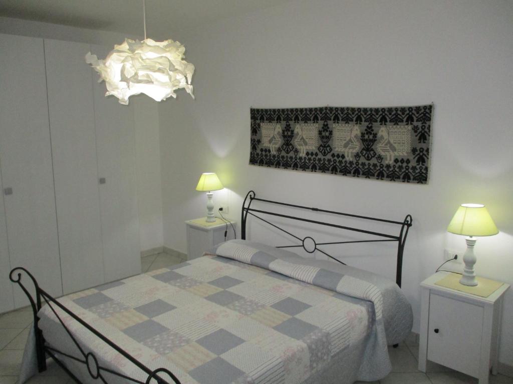 Posteľ alebo postele v izbe v ubytovaní SoleMare Sud Sardegna