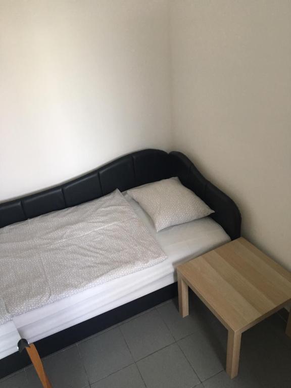 Postel nebo postele na pokoji v ubytování Tocc Apartman