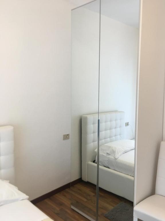 Postel nebo postele na pokoji v ubytování Albergo al lago