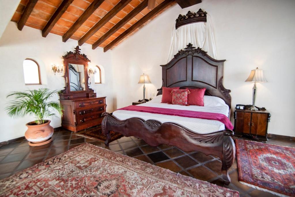 Postel nebo postele na pokoji v ubytování BellView Hotel Boutique