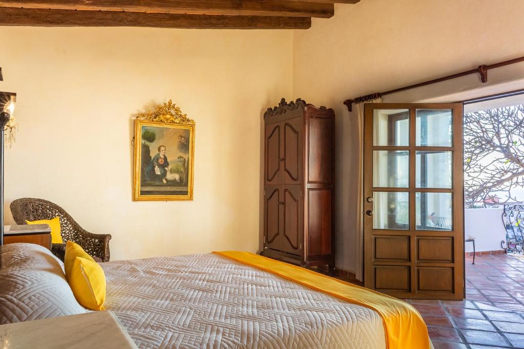 Postel nebo postele na pokoji v ubytování BellView Hotel Boutique