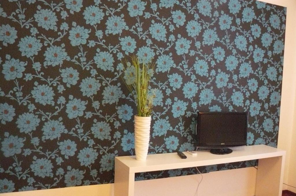 TV a/nebo společenská místnost v ubytování Hotel Vittoriano