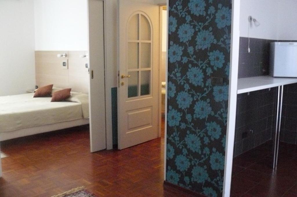 Postel nebo postele na pokoji v ubytování Hotel Vittoriano