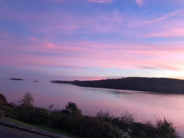 a view of a large body of water at sunset at Bay View B&B Glandore in Glandore