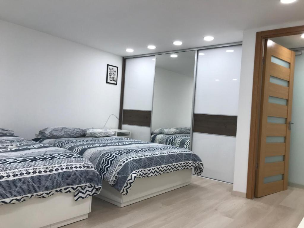 Posteľ alebo postele v izbe v ubytovaní Blaha Art Apartment