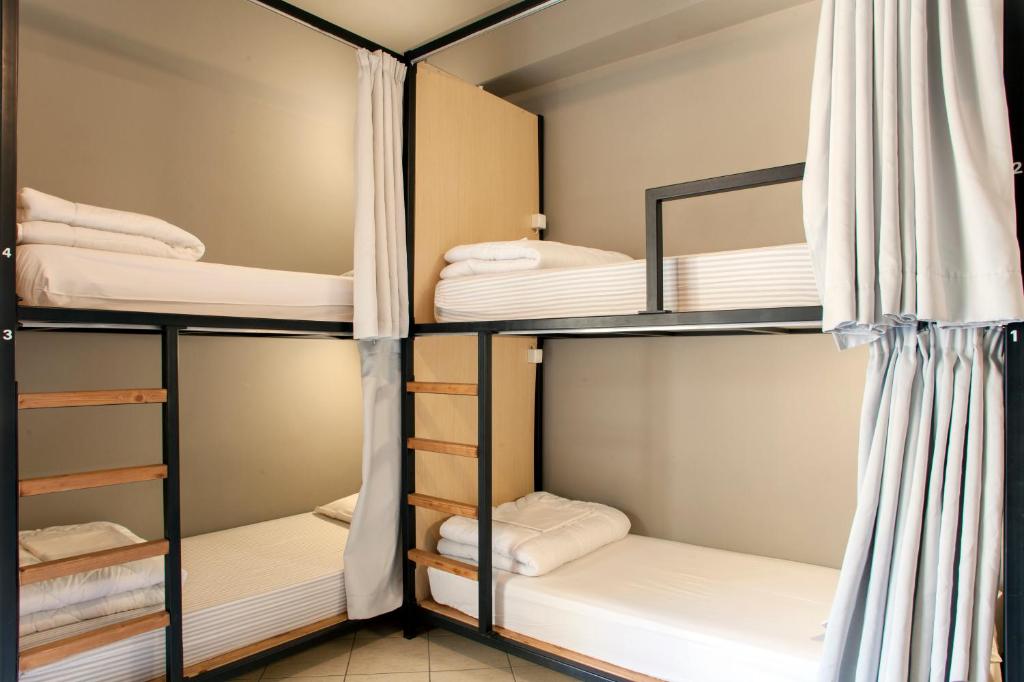 Postel nebo postele na pokoji v ubytování So Young Hostel