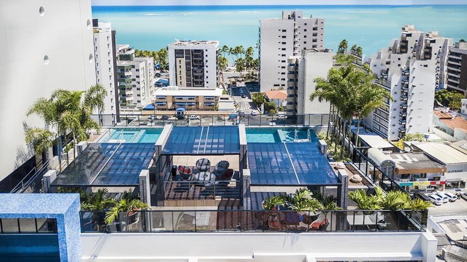 an aerial view of a building with a swimming pool at Edifício Time - Apto 517 in Maceió