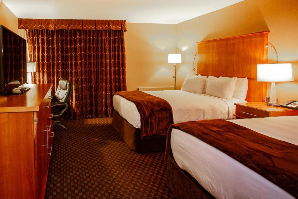 Postel nebo postele na pokoji v ubytování Mirabeau Park Hotel