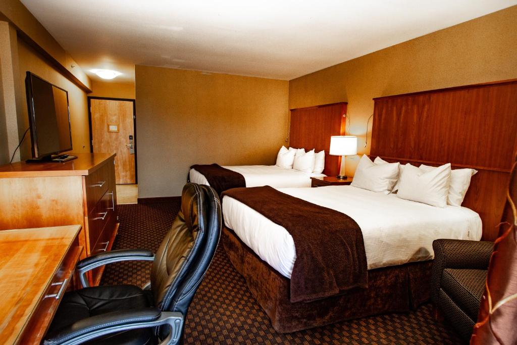 Postel nebo postele na pokoji v ubytování Mirabeau Park Hotel