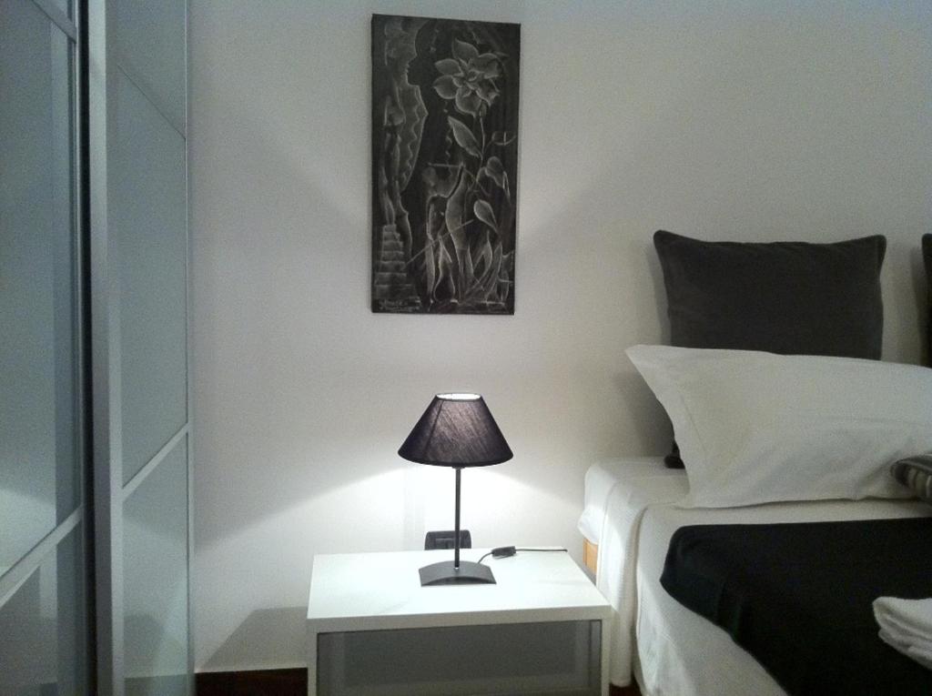 Postel nebo postele na pokoji v ubytování iBed Napoli B&B