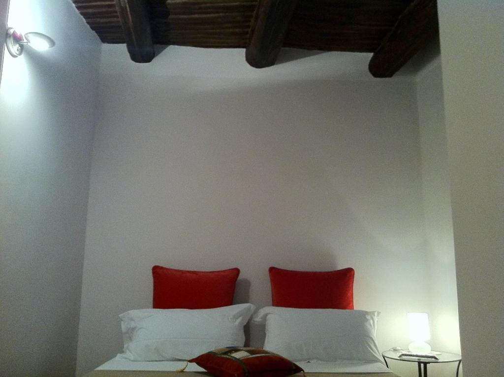 Postel nebo postele na pokoji v ubytování iBed Napoli B&B