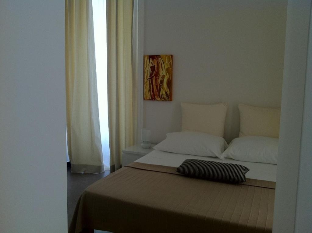 Postel nebo postele na pokoji v ubytování iBed Napoli B&B