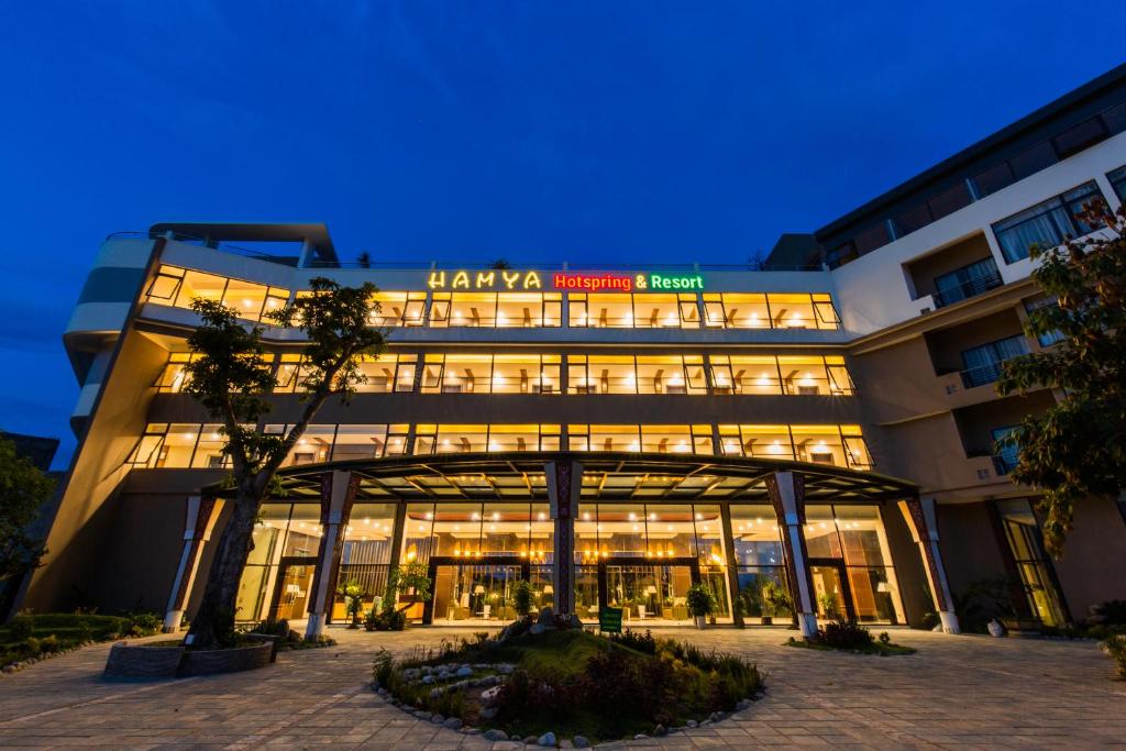 a hotel with a lit up building at night at Hamya Hotsprings and Resort in Quảng Ngãi