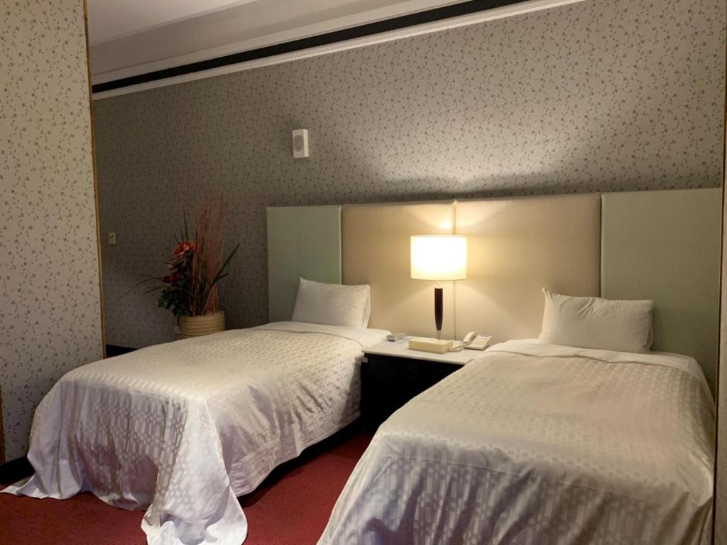 Postel nebo postele na pokoji v ubytování LI-GIN Motel
