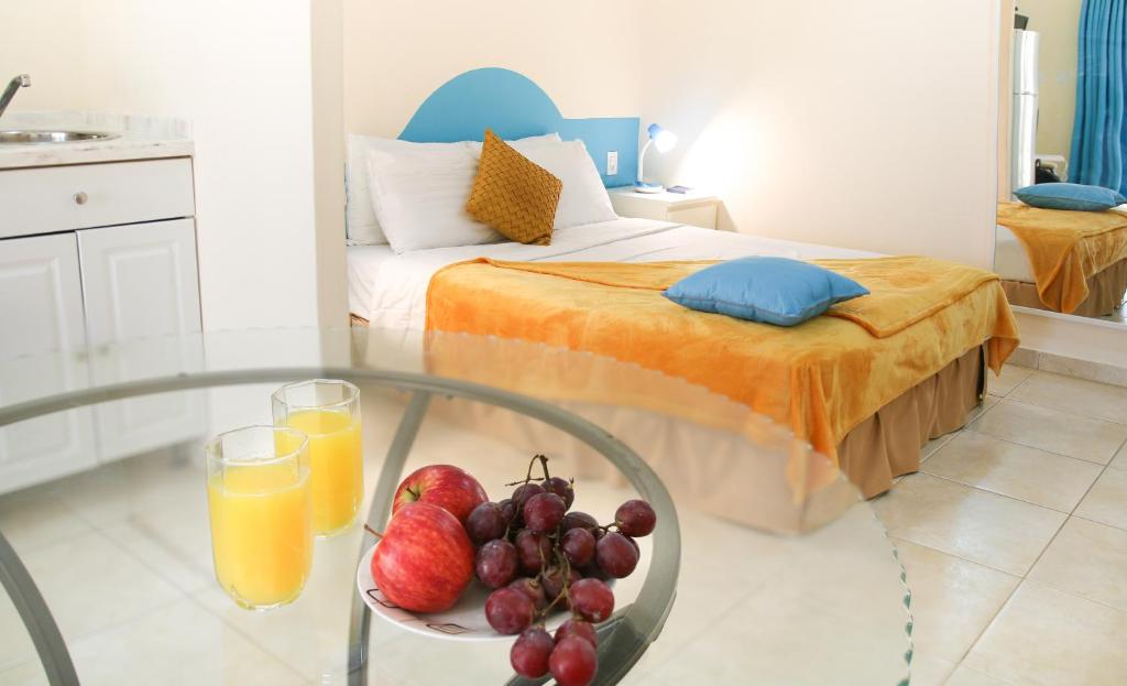 Postel nebo postele na pokoji v ubytování Aqua Viva Suites