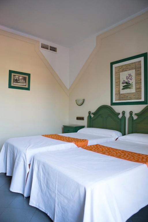 Postel nebo postele na pokoji v ubytování Hotel Mitra Crisálida