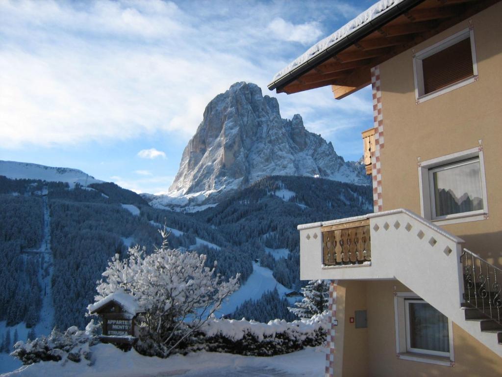 a building with a view of a mountain at Apartments Etruska in Santa Cristina in Val Gardena