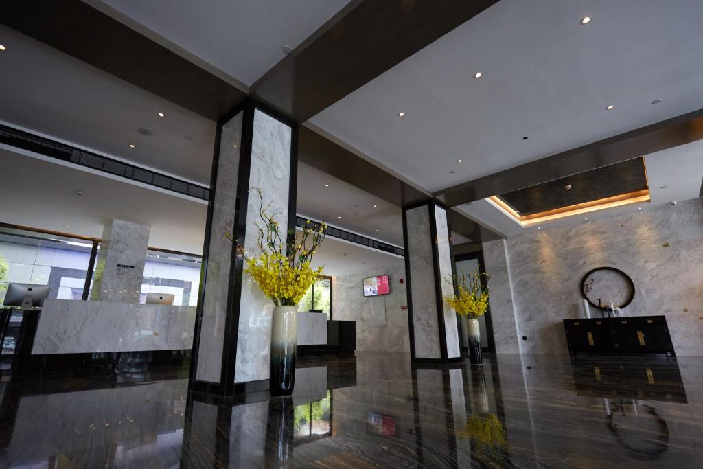 TV a/nebo společenská místnost v ubytování Paco Hotel Guangzhou Baiyun Airport Liantang Metro
