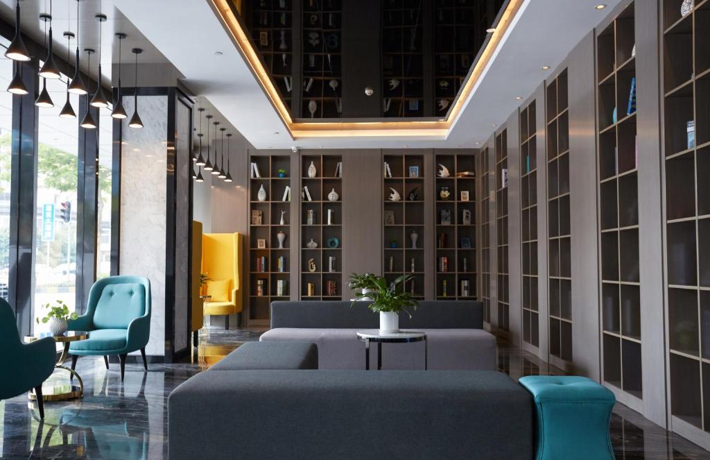 Posezení v ubytování Paco Hotel Guangzhou Baiyun Airport Liantang Metro