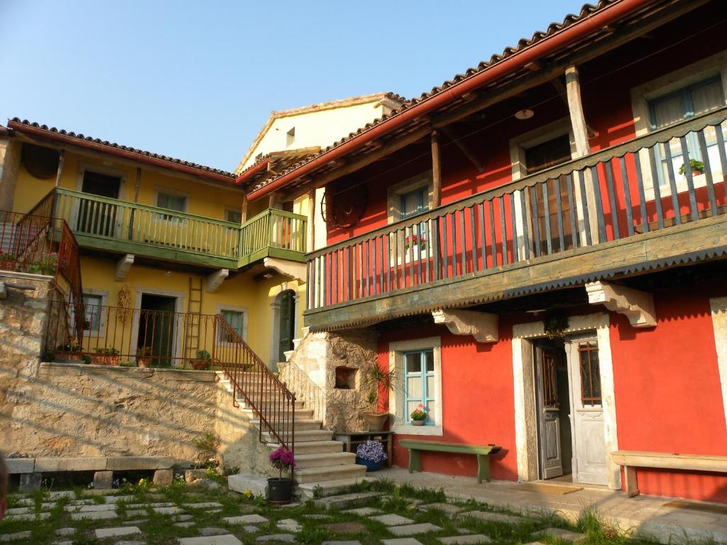 a group of buildings with stairs and balconies at Casa - hiša Klarčeva in Ceróglie dellʼErmada