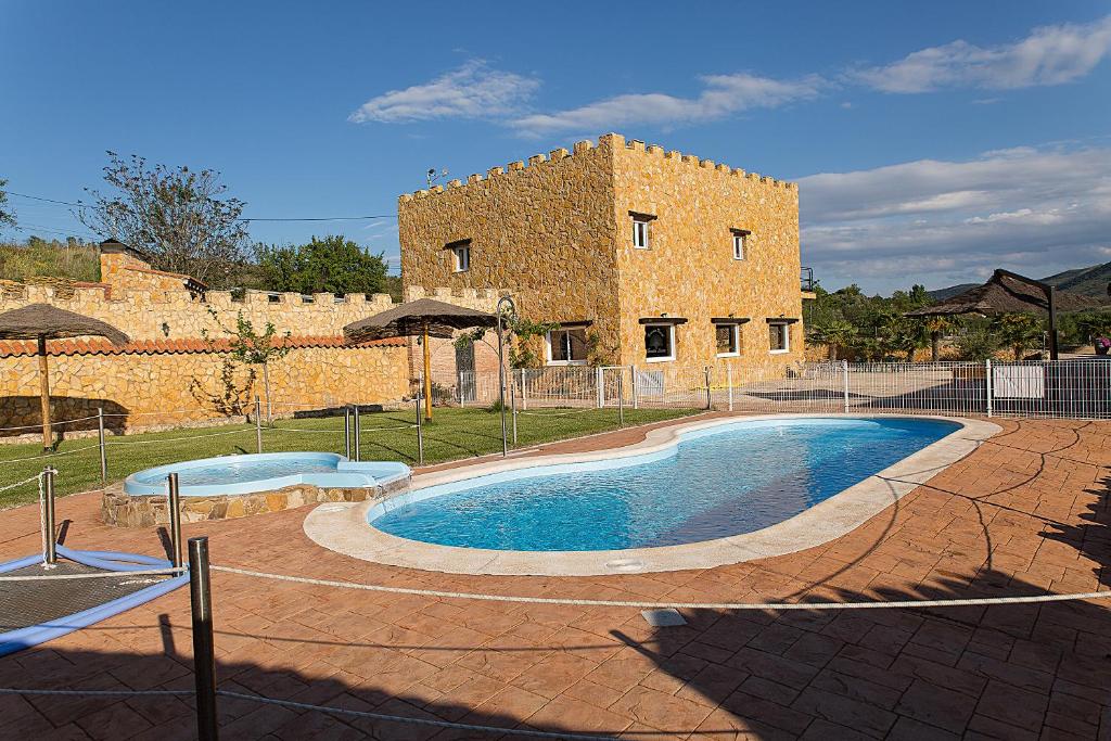 a large swimming pool in front of a building at Turismo Rural Santa Lucia in Ateca