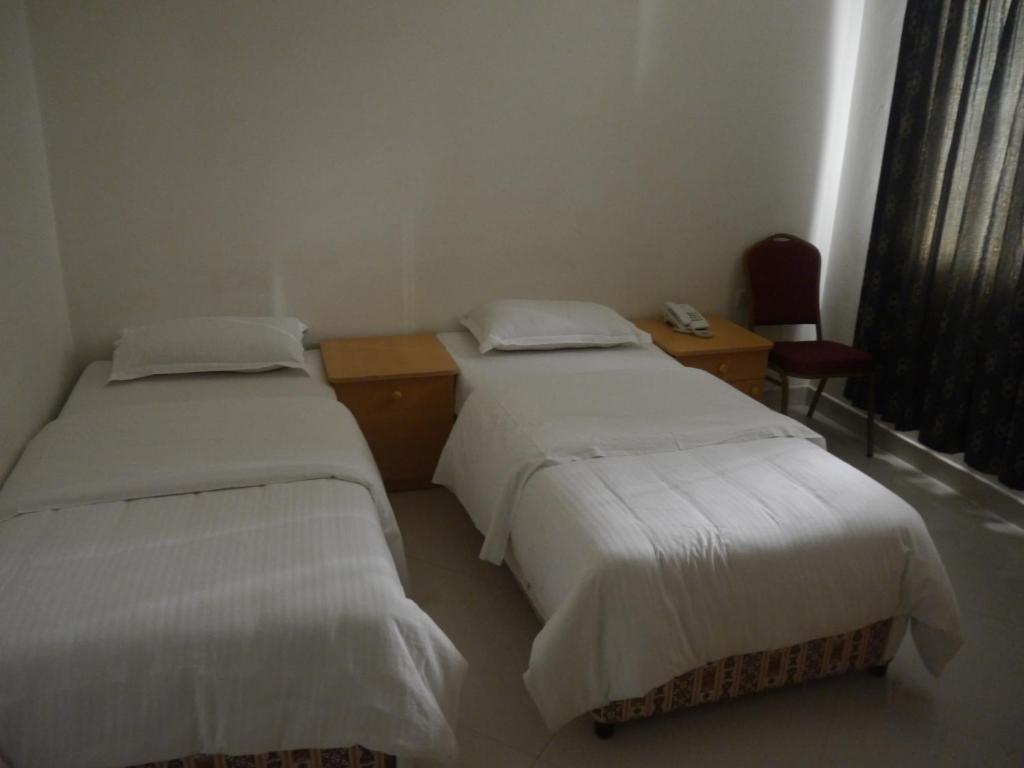 Postel nebo postele na pokoji v ubytování Plaza Hotel