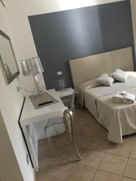 Postel nebo postele na pokoji v ubytování B&B Timpe Bianche