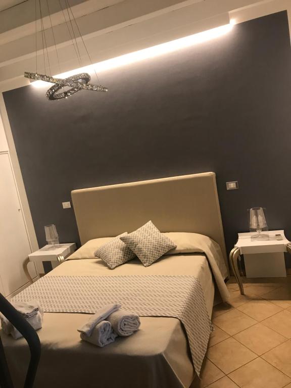 Postel nebo postele na pokoji v ubytování B&B Timpe Bianche