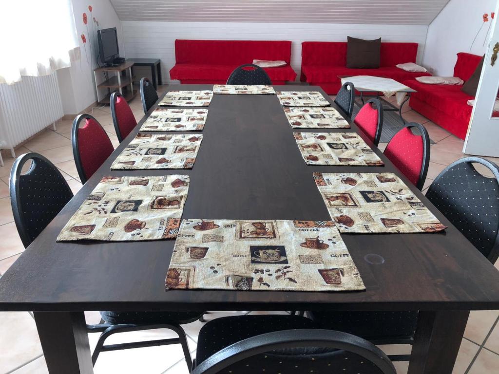 a conference room with a long table with chairs at Apartment BLN in Oststeinbek