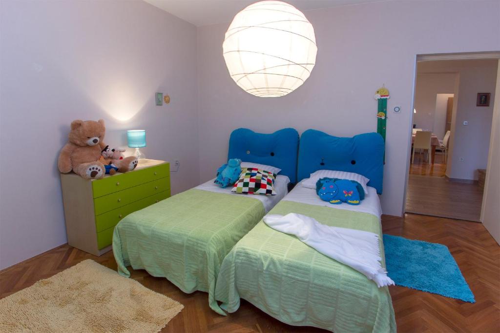 Posteľ alebo postele v izbe v ubytovaní Apartment Varga