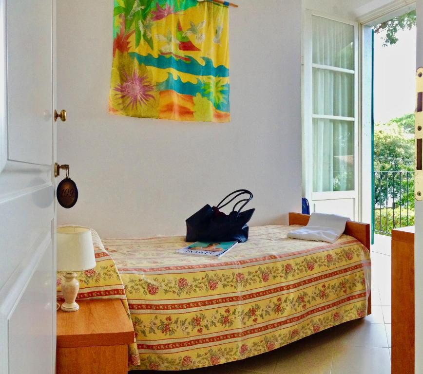 Postel nebo postele na pokoji v ubytování Hotel Villa Fiorisella