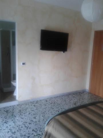 Televízia a/alebo spoločenská miestnosť v ubytovaní Bed And Breakfast Il Subacqueo